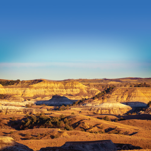 A landscape featuring painted canyon walls